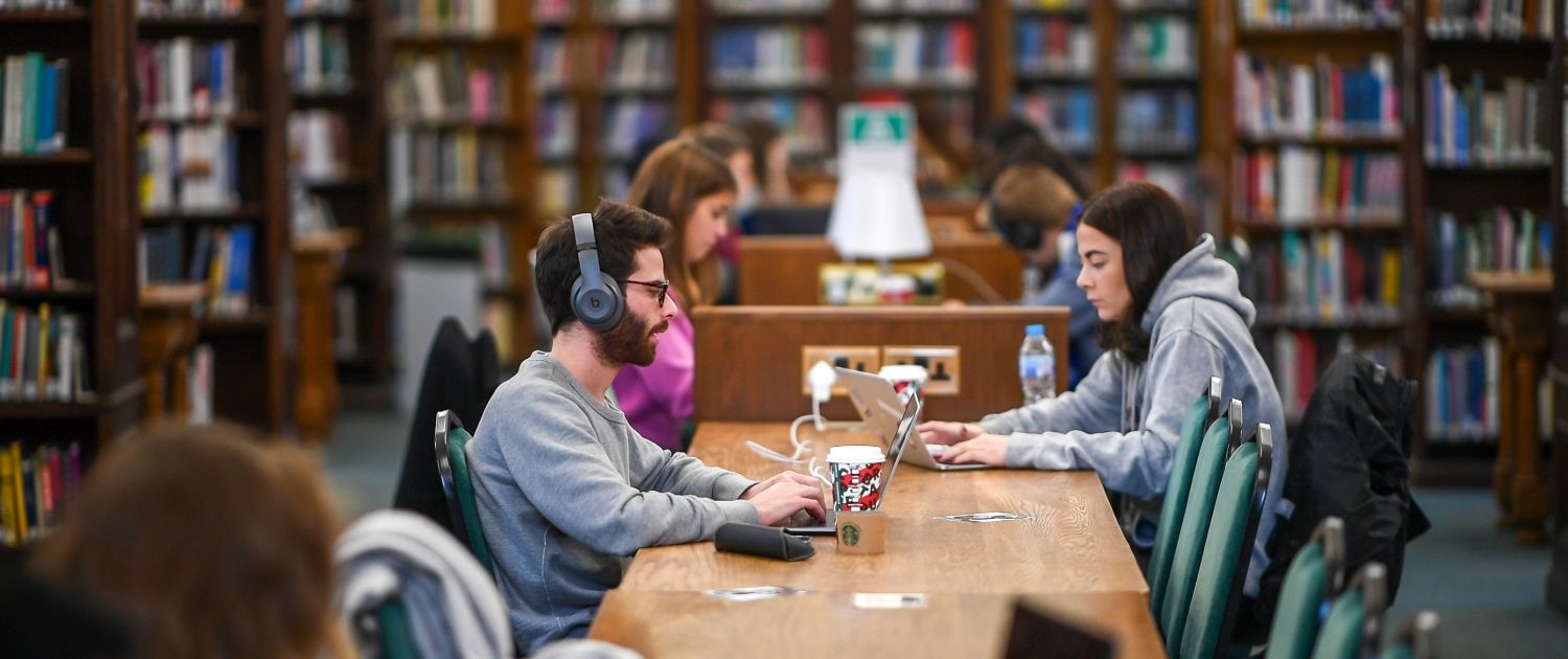 Students in the library Image of students studying in the library
